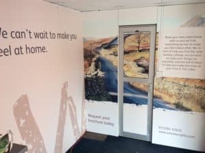 The interior of the Wheelwrights trailer, revealing graphics decals on the walls.