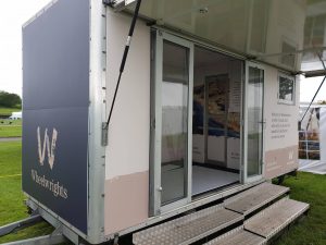 A Wheelwrights trailer opened at the side to convert it to a small room.