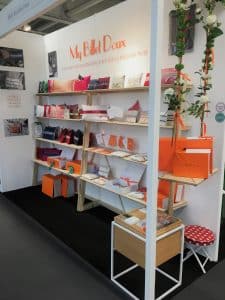 Some shelving on a wall, above which are acrylic cutout leters on a wall reading My Billet Doux.