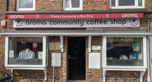 The exterior of Aroma Community Coffee Shop.