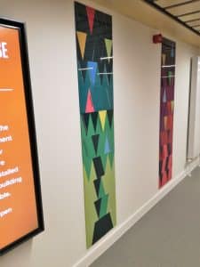 A Perspex panel, green, seen at an angle.